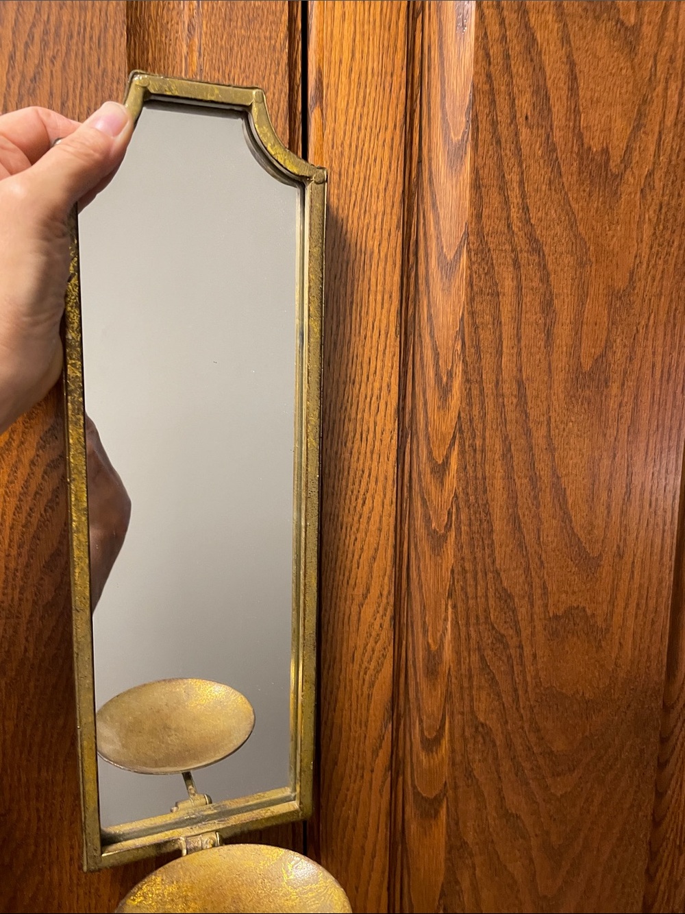Two Gold Wall-Mounted Mirror with Dual Decorative candle holder.